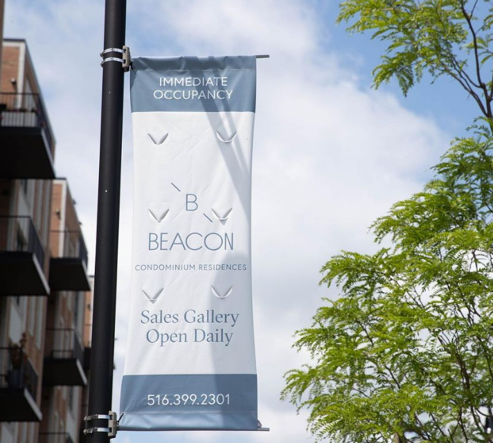 Enhancing Building Entrances with Eye-Catching Banners and Awnings